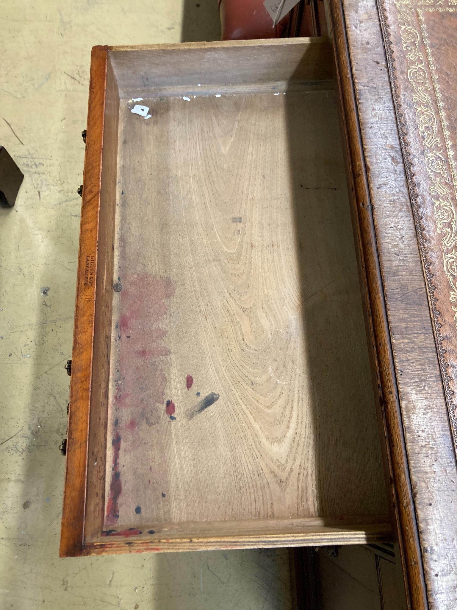 An Edwardian mahogany kneehole desk